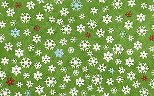 green and white snowflakes print textile